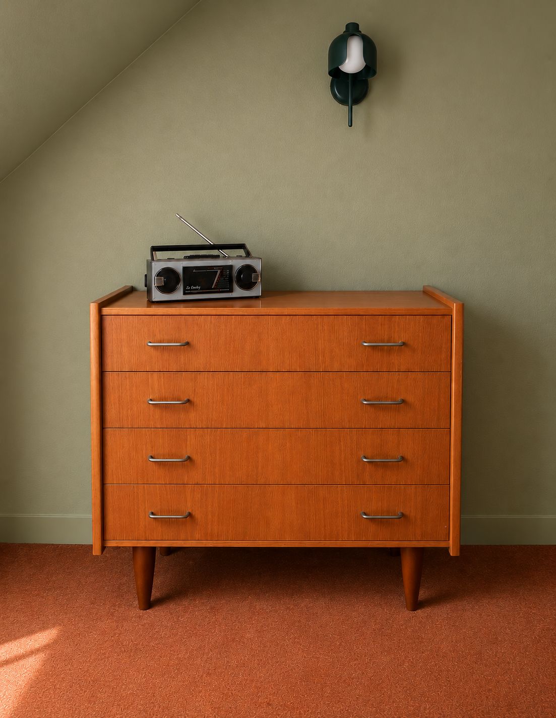 A wooden dresser with drawers and a radio on top.
