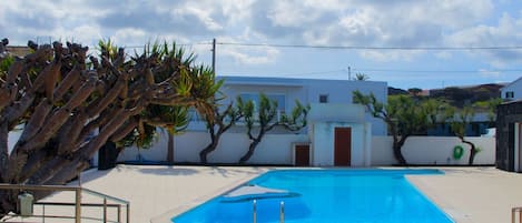 Outdoor pool, pool umbrellas, pool loungers