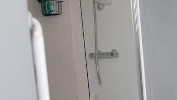 Combined shower/bathtub, deep-soaking bathtub, hair dryer, towels