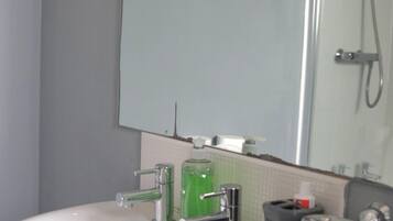 Combined shower/bathtub, deep-soaking bathtub, hair dryer, towels