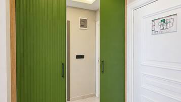 Shower, rainfall showerhead, hair dryer, towels
