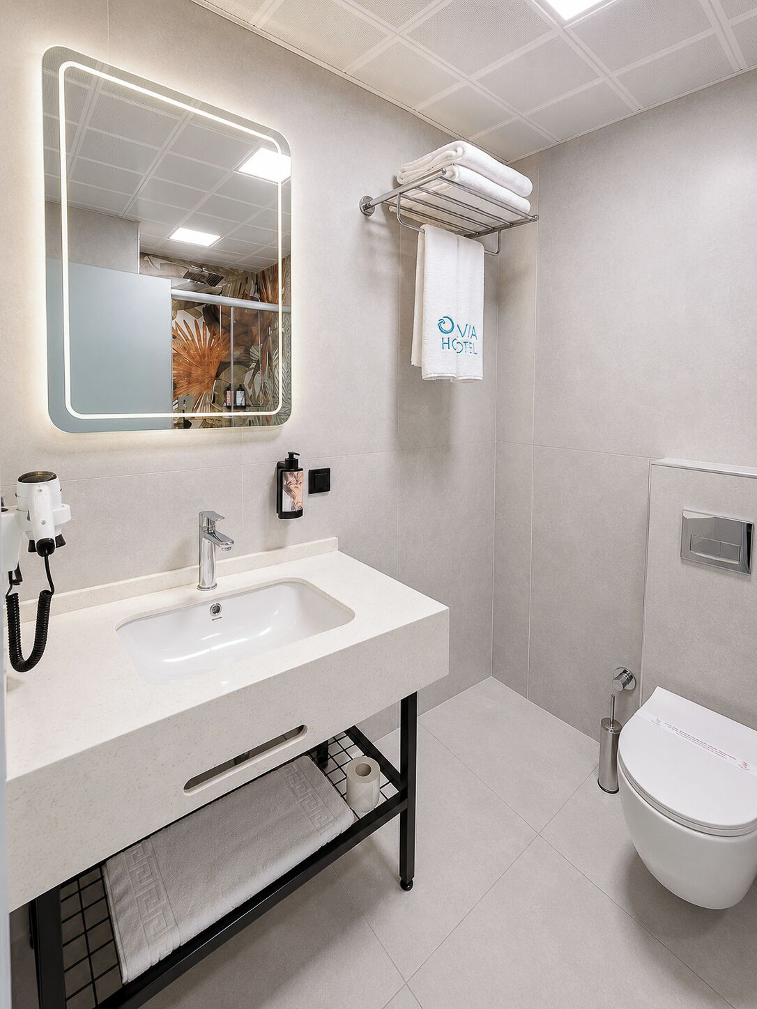 Shower, rainfall showerhead, hair dryer, towels