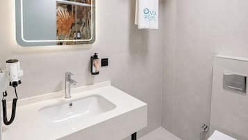 Shower, rainfall showerhead, hair dryer, towels