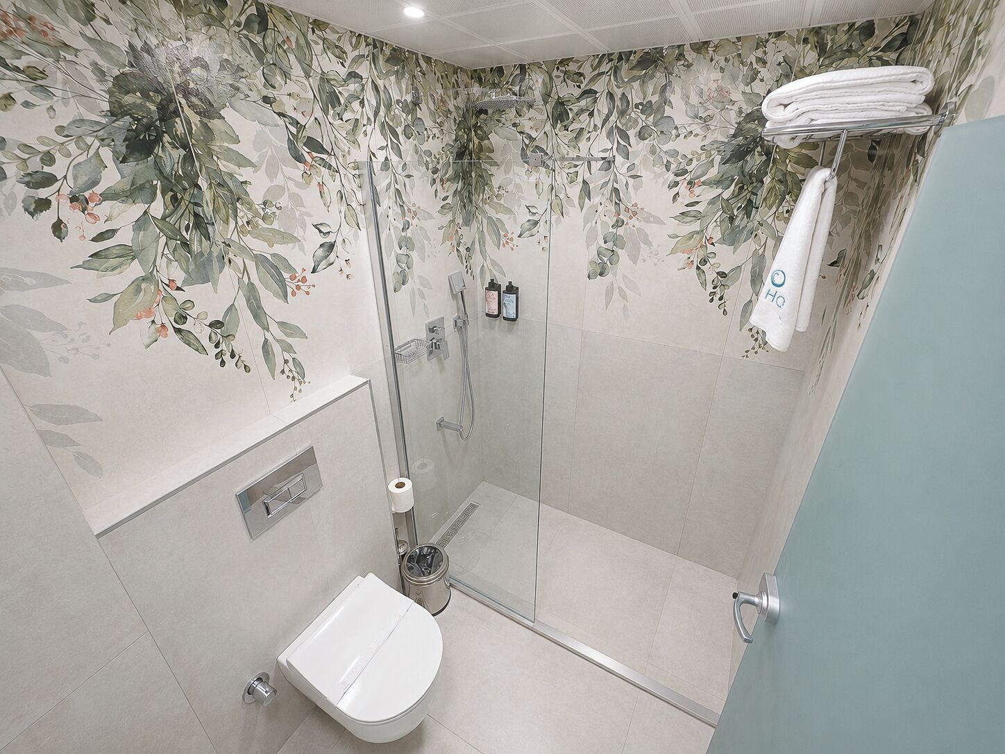 Shower, rainfall showerhead, hair dryer, towels