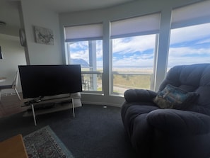 Your bright, modern space features a sleek TV and kitchenette perfect for easy meals at home. Step outside and enjoy peaceful winter views right from your window. - Downtown Oceanfront Seaside Retreat | • King Suite • Sleeps 4 (Seaside)