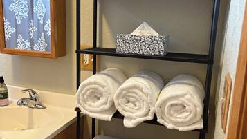 Hair dryer, towels, soap, toilet paper