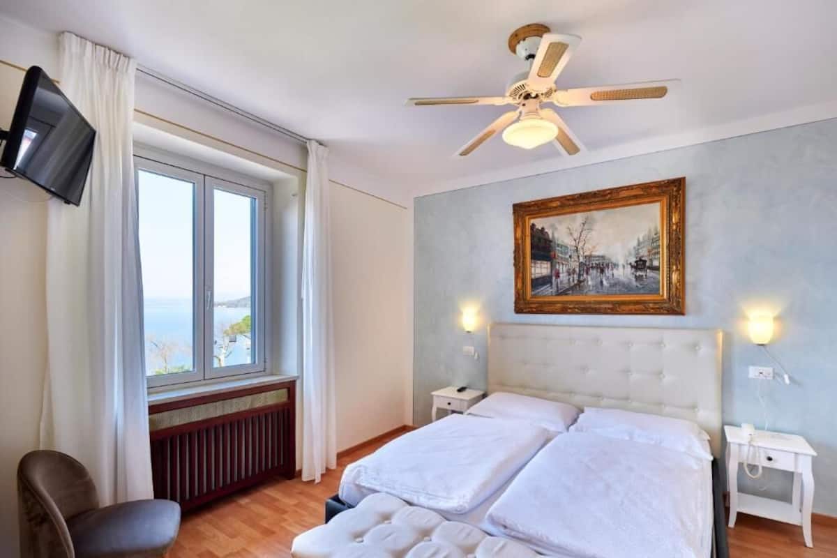Family Quadruple Room, Lake View | In-room safe, soundproofing, free WiFi