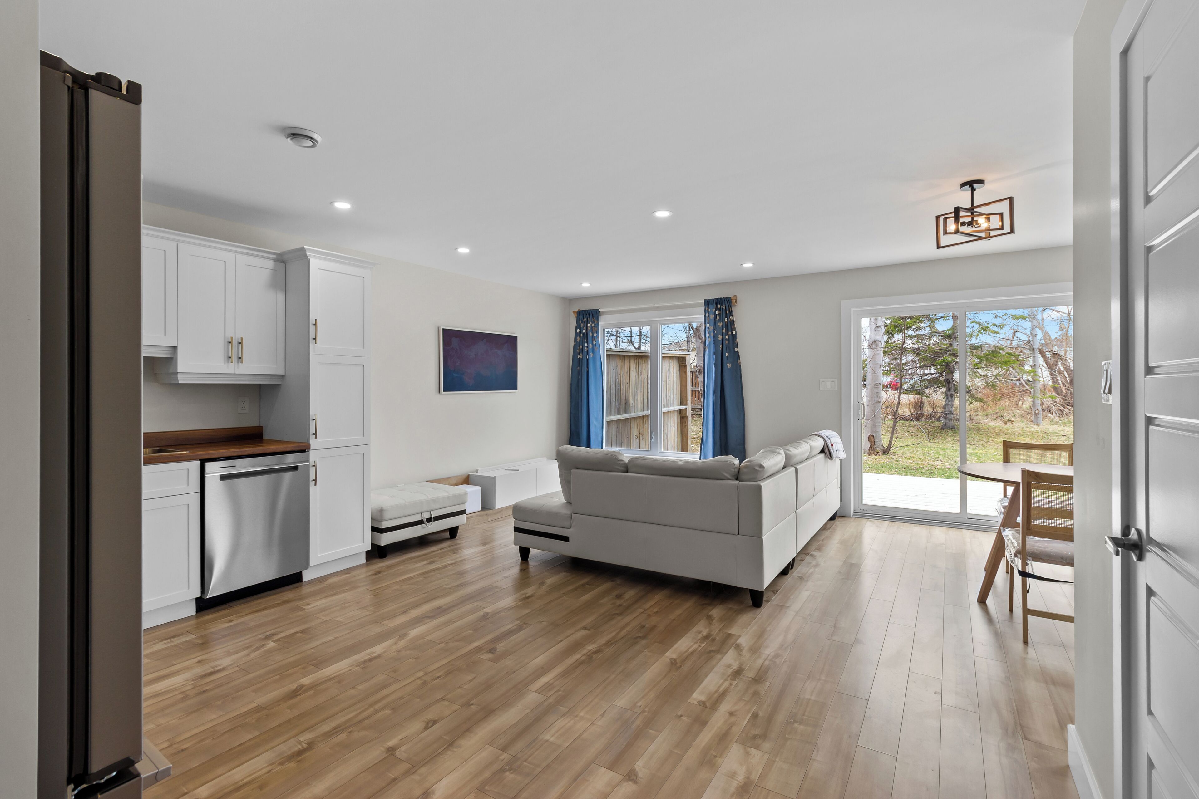 Bright open-concept living area with seamless indoor-outdoor flow.