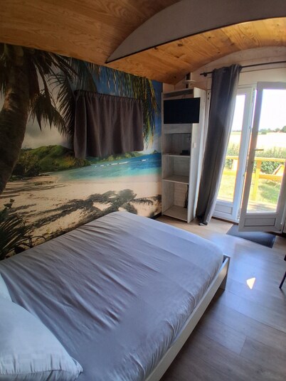 Camille's trailer with a spa-style relaxation area at the Domaine du Reuze