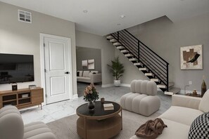 Living area - Sleek&Serene:Fully Furnished Home w/ Freestanding Tub, Marble Tile & Cozy Lounge (Woodbury)