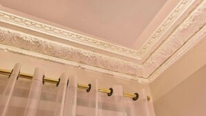 A bathroom with a decorative ceiling, a curtain rod, and a curtain. - Deluxe Loft at Le Moulin Vert (Paris)