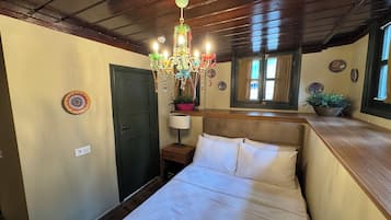 Economy Double Room | Minibar (free items), in-room safe, desk, laptop workspace