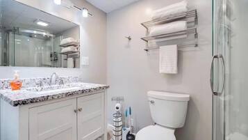 Shower, towels, soap, toilet paper