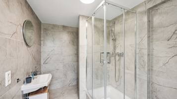 Shower, hair dryer, towels, soap