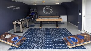 A room with a foosball table, a ping pong table, and a pool table. - 13 Min to Beaver Stadium | Game Room, Deck (Bellefonte)