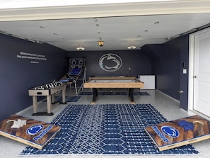 A room with a foosball table, a ping pong table, and a pool table. - 13 Min to Beaver Stadium | Game Room, Deck (Bellefonte)