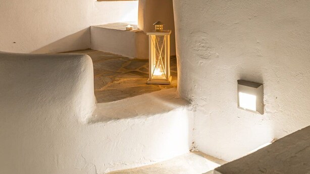 A white-walled building with a stone floor, a lantern, and a small window. - Villa Calivion, Private Outdoor Hot Tub, Furnished Terrace, Shared Pool, Naxos (Naxos)