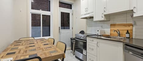 Coffee/tea maker, fridge, microwave, oven