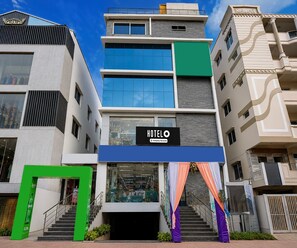 A hotel with a modern facade, multiple floors, and a prominent 'HOTELO' sign. - Deluxe Hotel O Satyam Junction (Visakhapatnam)
