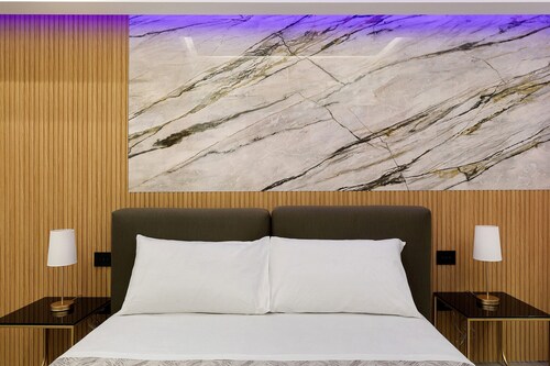 Deluxe Suite with Balcony, Wi-Fi, and Air Conditioning