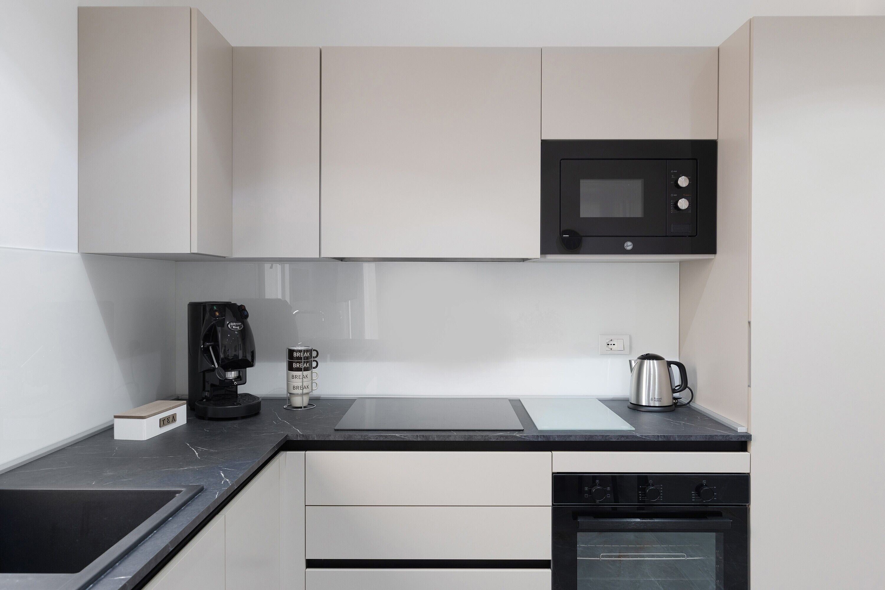 Coffee/tea maker, fridge, microwave, oven