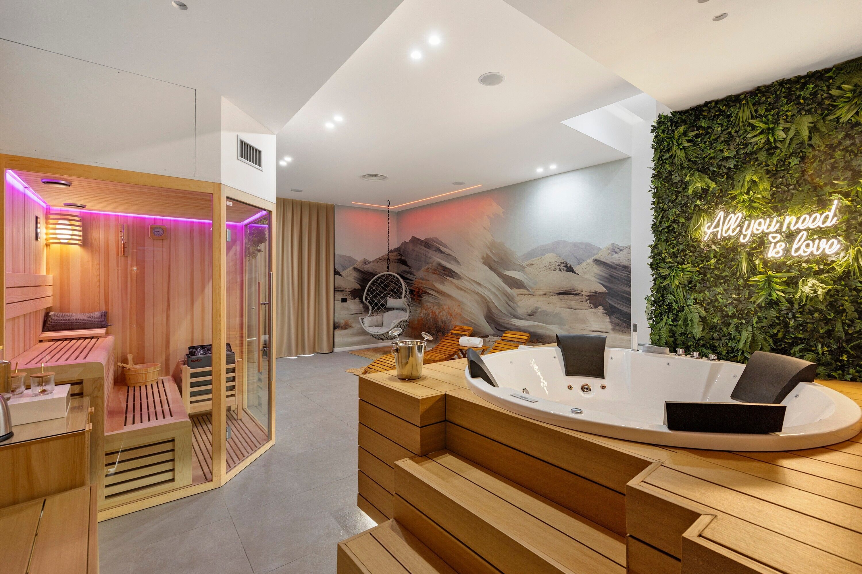 A modern spa area with a wooden reception desk, a massage chair, and a wall with a neon sign.