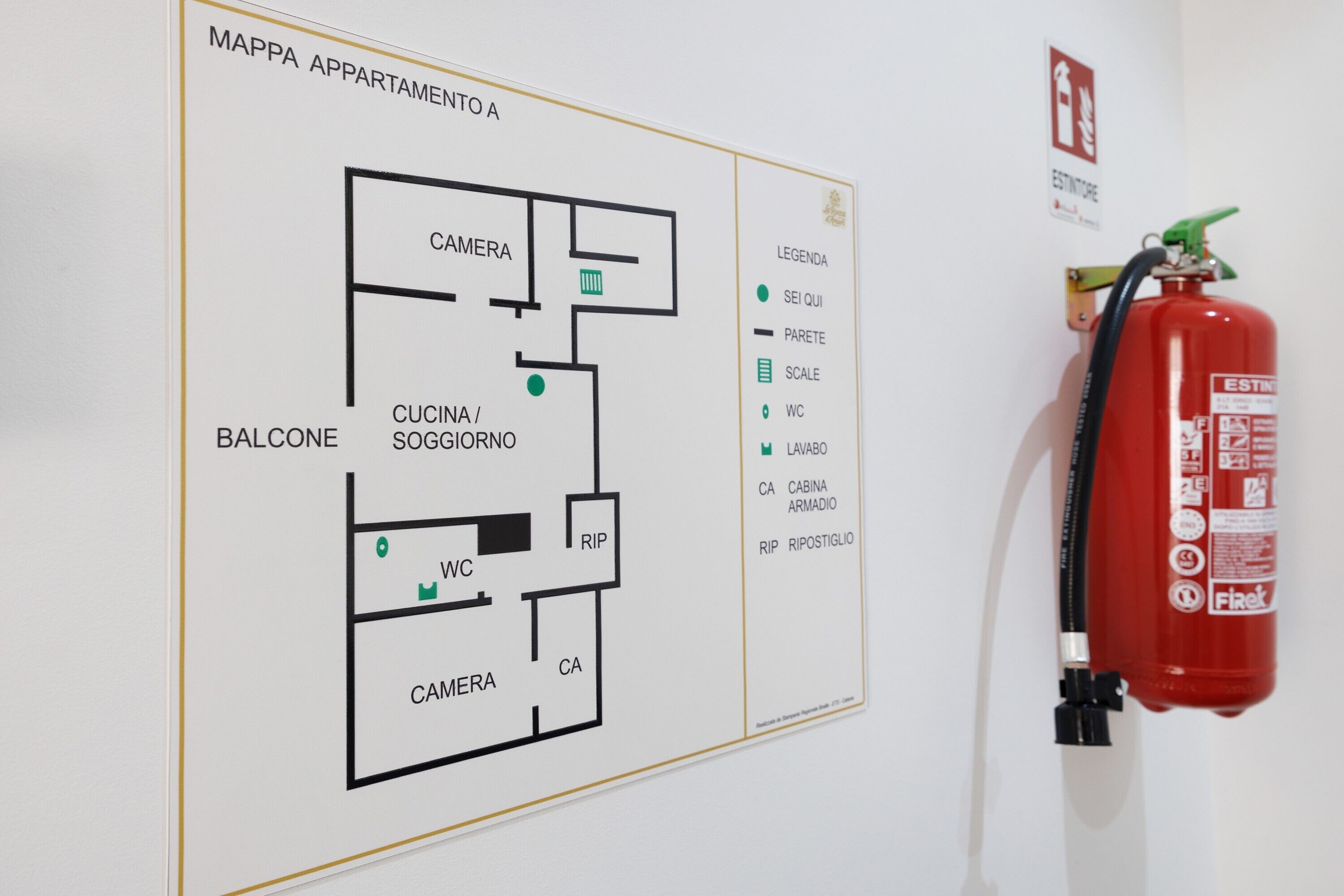 A hotel floor plan with a balcony, kitchenette, and a camera room.