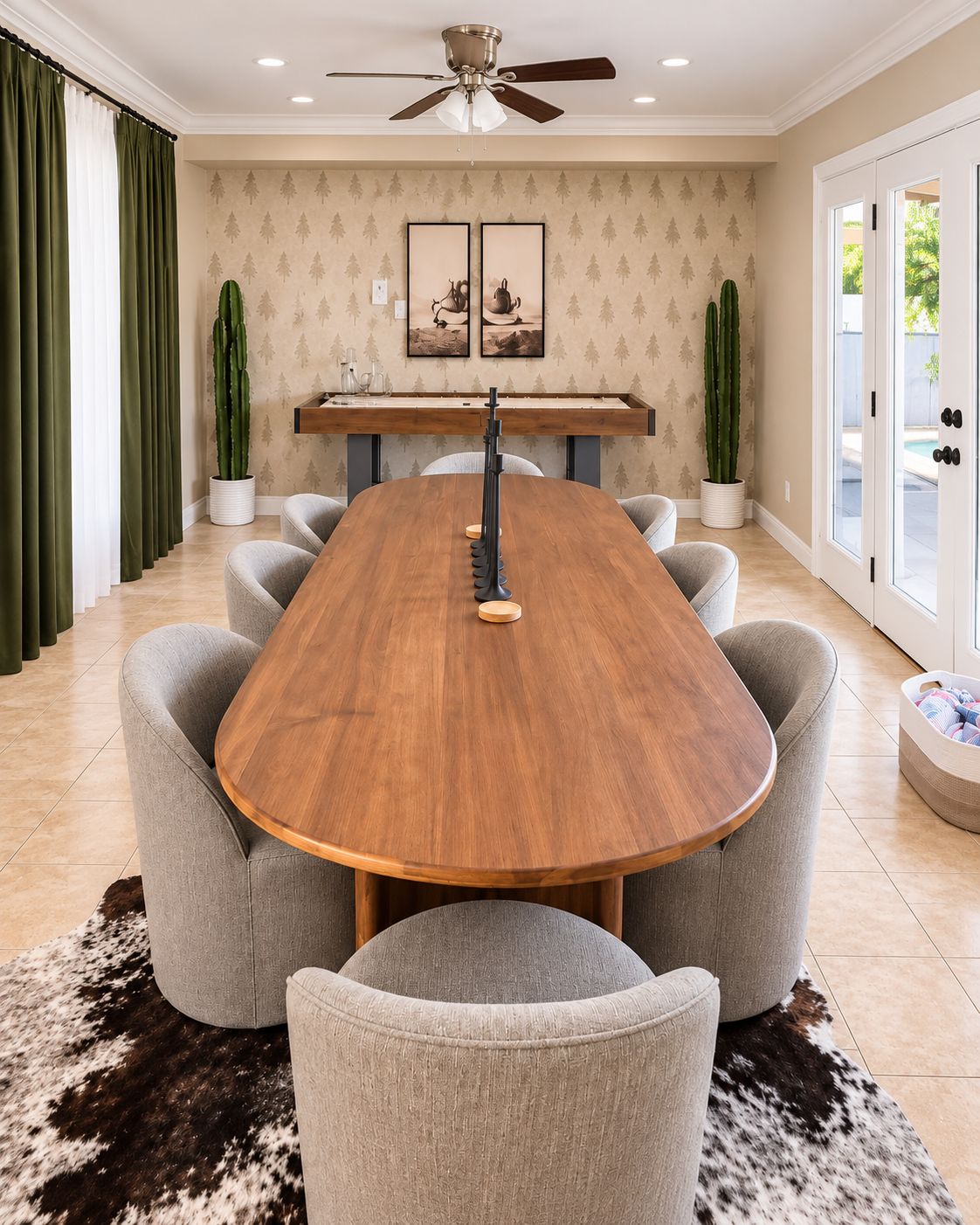 A dining room with a wooden table, grey upholstered chairs, a ceiling fan, and a patterned wallpaper.