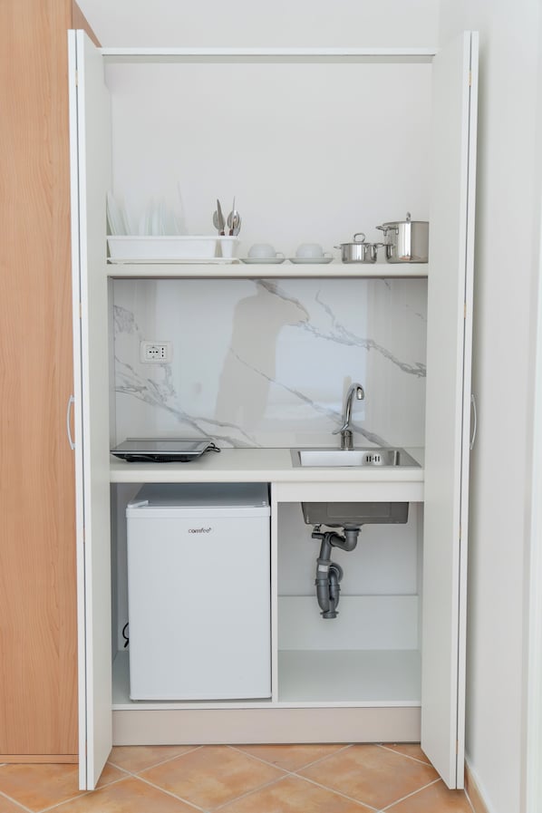Habitación Confort con 1 cama matrimonial o 2 individuales, balcón, vista al jardín | Interior