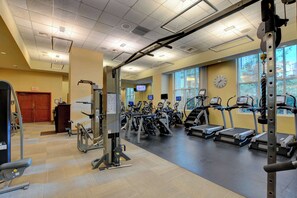 A gym with treadmills, elliptical machines, and weightlifting equipment. - MGM Signature-04-609 Strip View Jacuzzi Studio (Las Vegas)