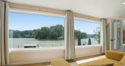 Tranquil Siltcoos Lakefront Gem w/ Luxurious Master Suite with View, Dock, EV Charger