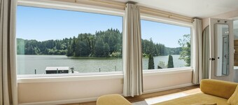 Tranquil Siltcoos Lakefront Gem w/ Luxurious Master Suite with View, Dock, EV Charger