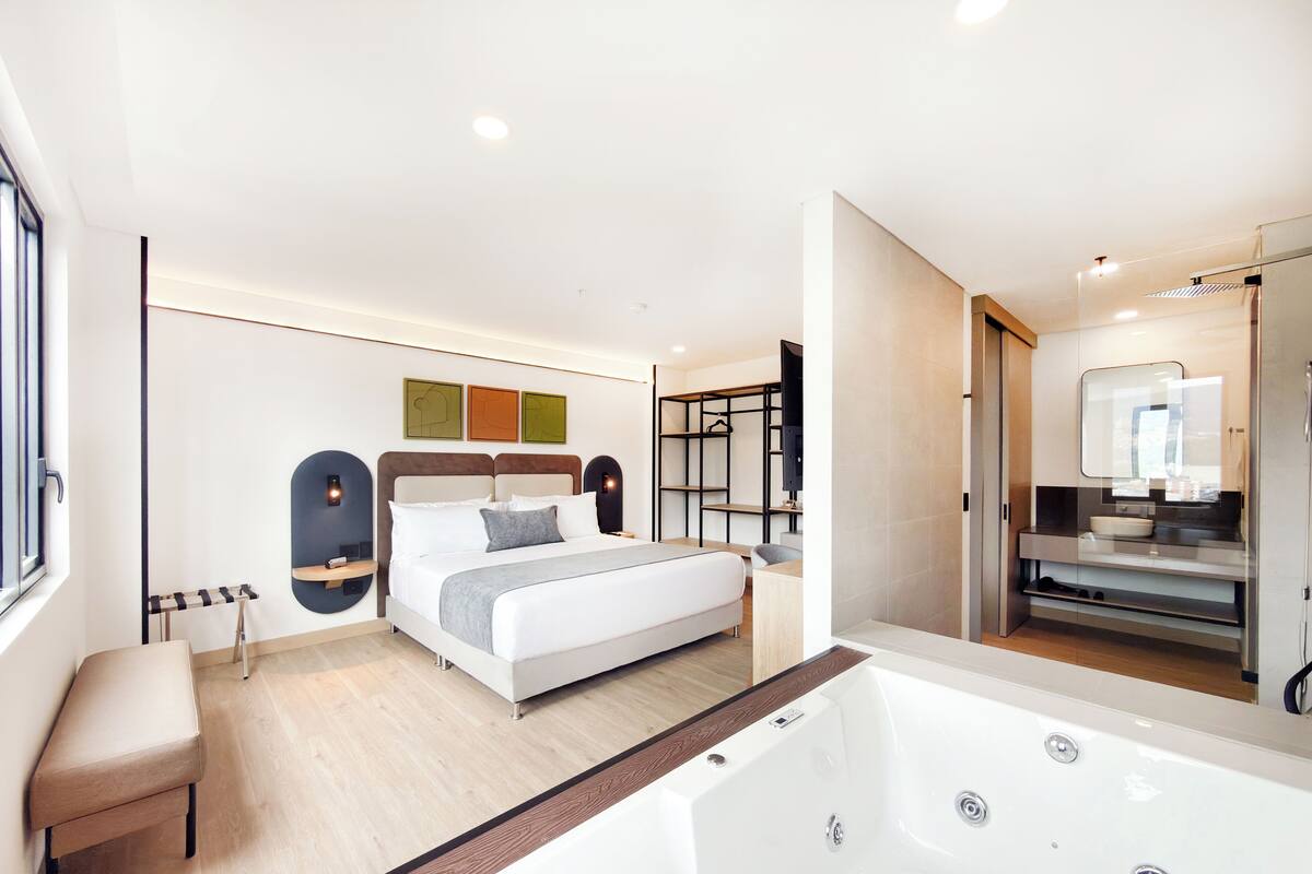 Luxury Suite | In-room safe, desk, blackout drapes, iron/ironing board (on request)
