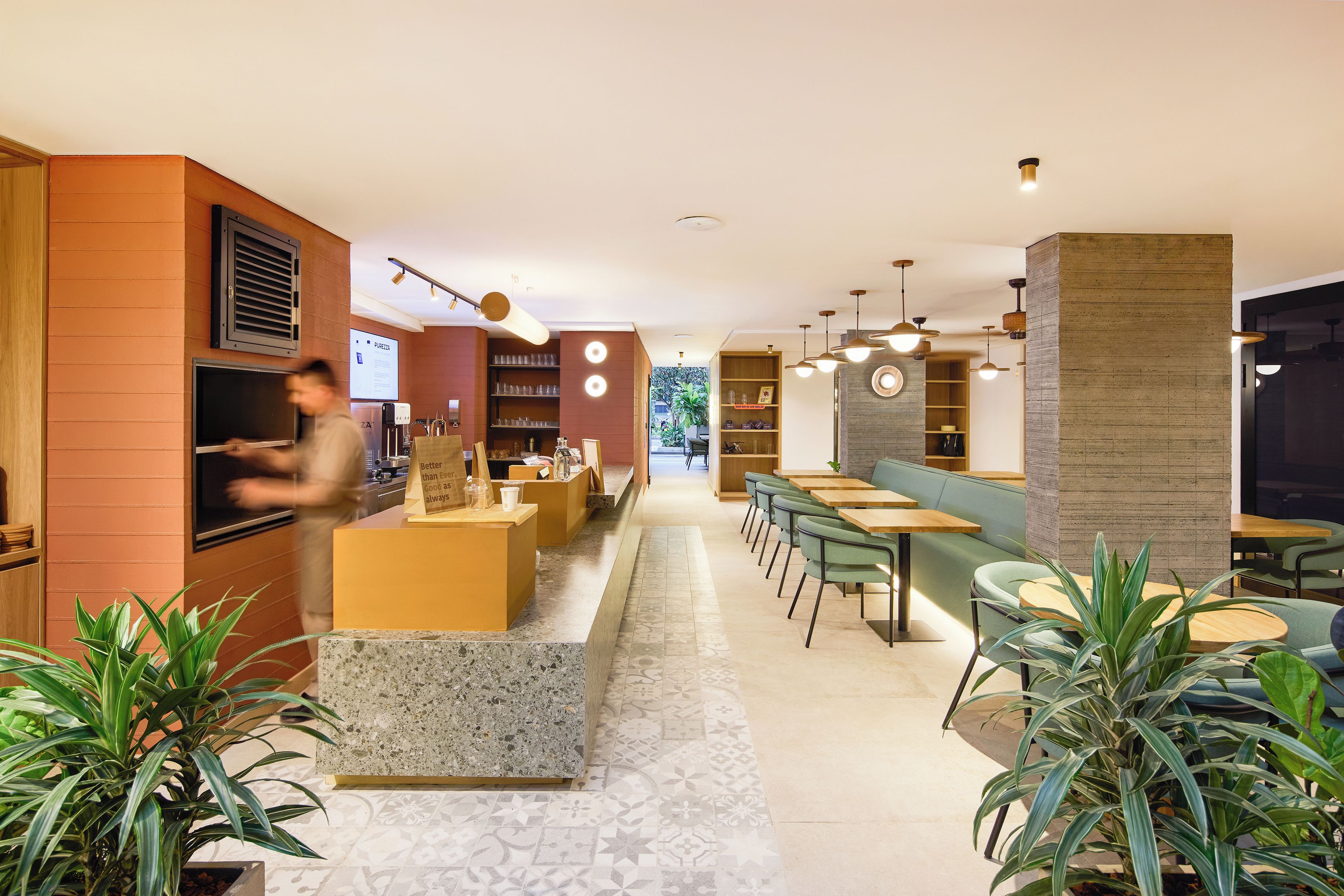 A modern interior with a bar area, seating, and a counter.
