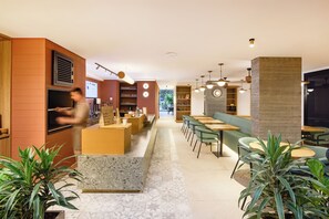 A modern interior with a bar area, seating, and a counter.