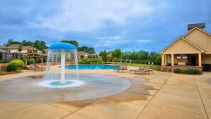 A swimming pool with a water fountain, lounge chairs, and a building with a porch. - Marvelous 4-bedroom house, 5 miles from the square in vibrant Athens (Athens)