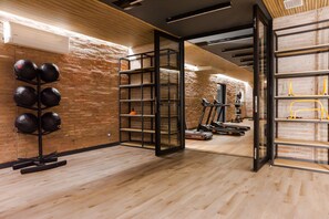 Familienapartment, Balkon | Fitnessbereich