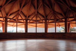 A spacious interior with a high wooden ceiling and large windows. - Casa X  (San Miguel de Allende)