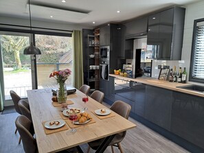 Dining - Riverside lodge with spacious decking, Ninja BBQ, Wi-Fi, Netflix-ready TV, EV charging and an outdoor copper bath and shower for a wellness experience in nature. Up to three well-behaved dogs are welcome in selected lodges. (Cornwall)
