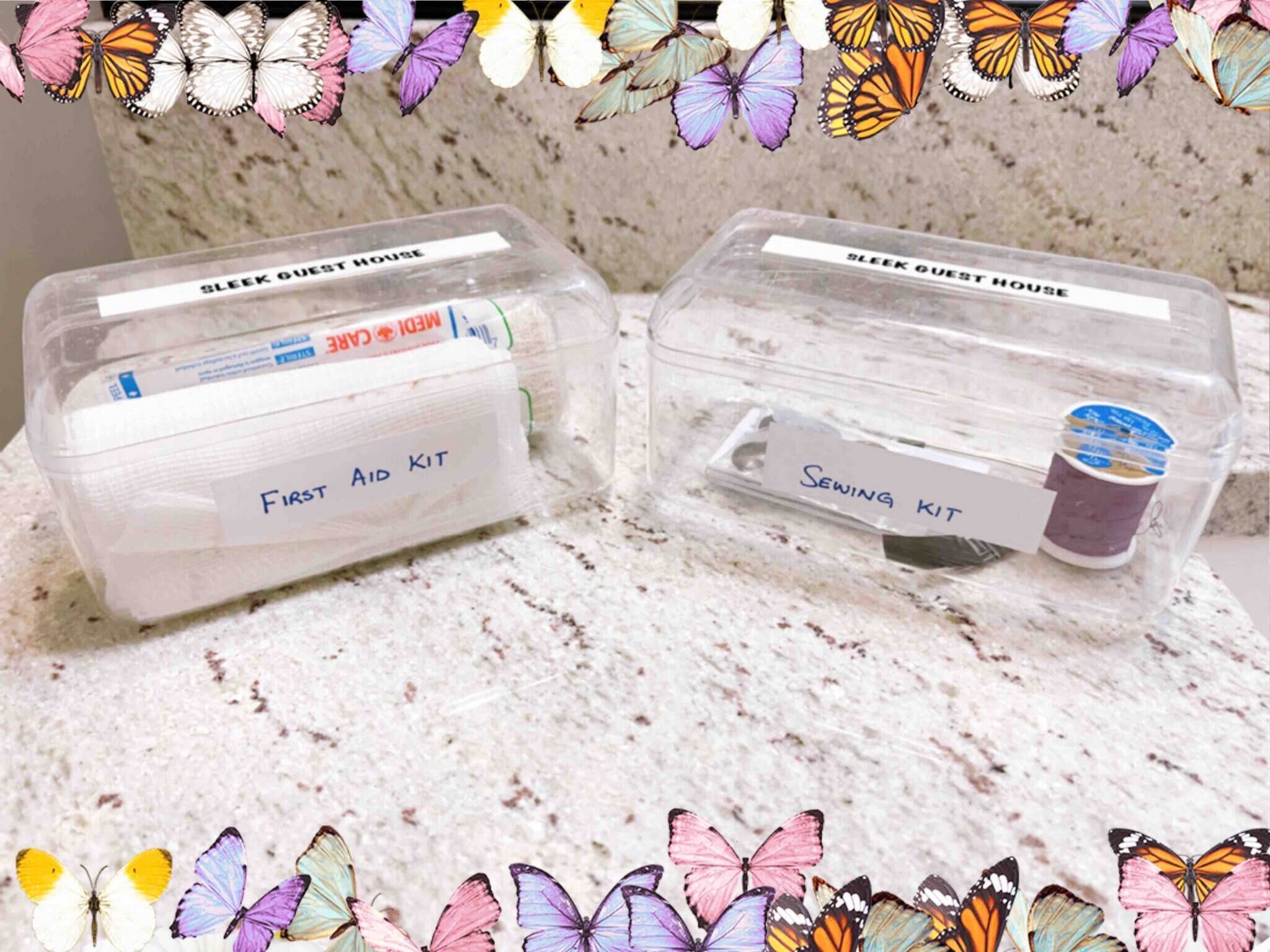 Two plastic storage containers labeled 'First Aid Kit' and 'Sewing Kit' on a marble countertop.