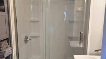 Shower, hair dryer, towels, toilet paper