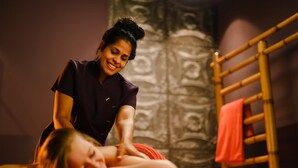 A massage therapy session in a room with a patterned wall and a wooden ladder. - Baltic Zinnowitz (Zinnowitz)