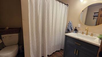 Shower, towels, soap, toilet paper