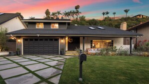 A residential house with a garage, a well-maintained lawn, and a mailbox. - LA Times "Hot Property" l HGTV Resort Estate near Dana Point Harbor (San Juan Capistrano)