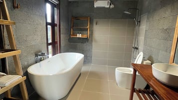 Combined shower/bathtub, slippers, soap, shampoo