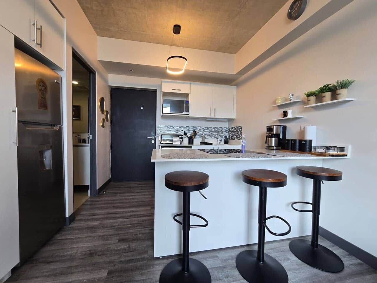 Fridge, microwave, stovetop, coffee/tea maker