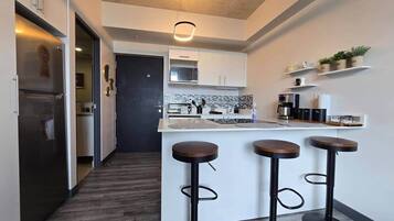 Fridge, microwave, stovetop, coffee/tea maker
