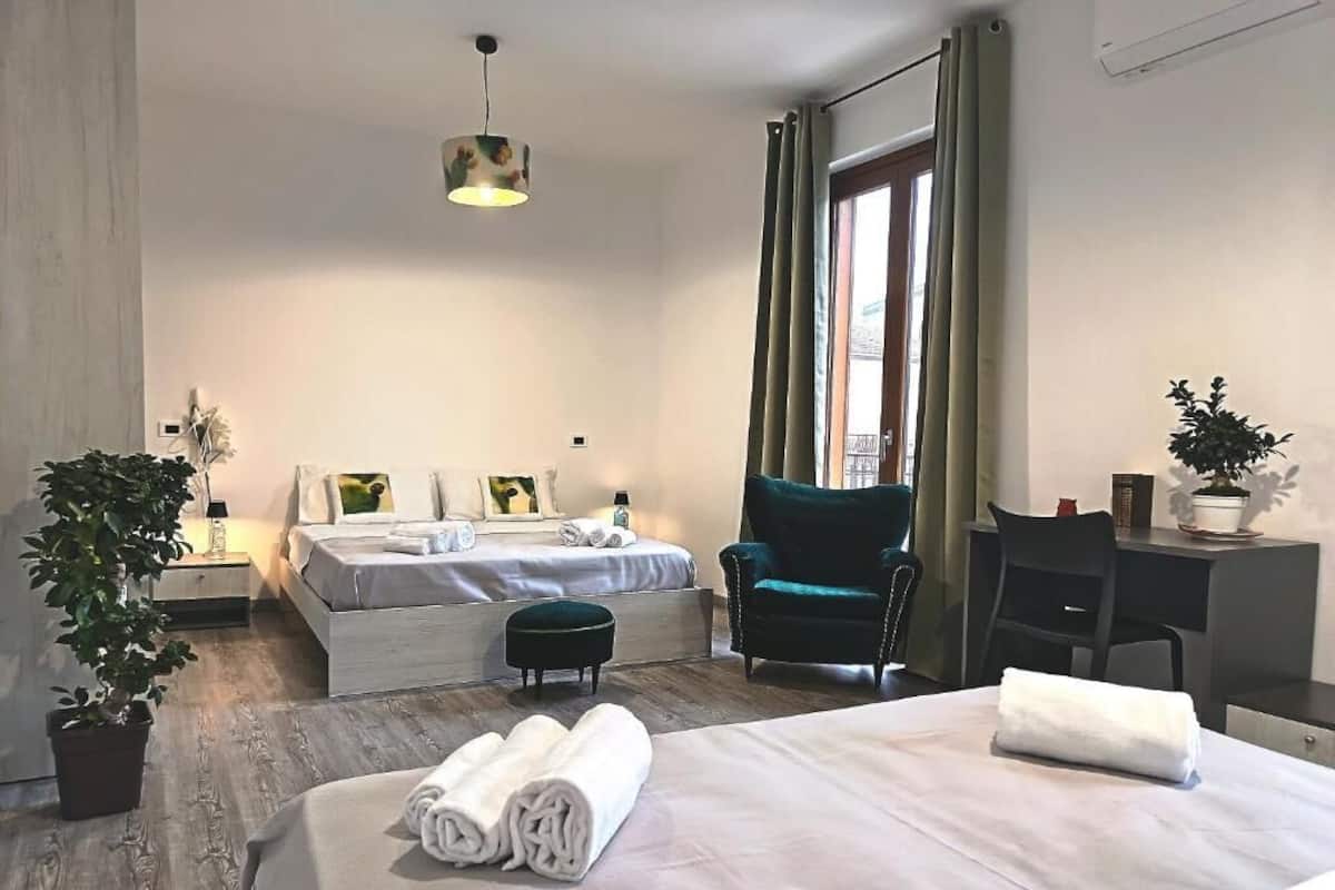 Deluxe Quadruple Room, Balcony, City View | Desk, laptop workspace, free WiFi