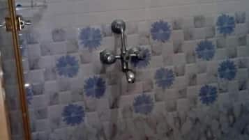 Deluxe Quadruple Room, Resort View | Bathroom | Shower, free toiletries, towels, soap