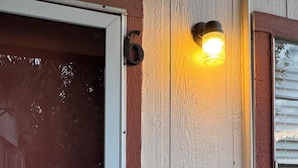 A door with a number six, a light fixture, and a window with blinds. - Downtown Wonderful cozy’s 1-bedroom apartment with AC in charming San Antonio (San Antonio)